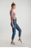  Kate Jones  1 blue jeans casual dressed pink long sleeve t shirt side view walking white sneakers whole body 0003.jpg